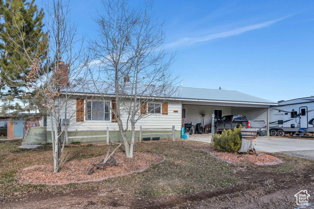 View of front of home featuring a carport