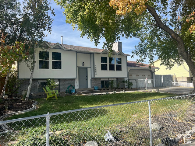 Split foyer home with a front lawn