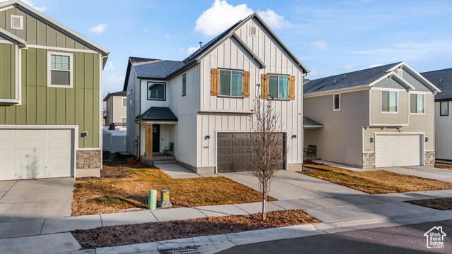 View of front of property with a garage