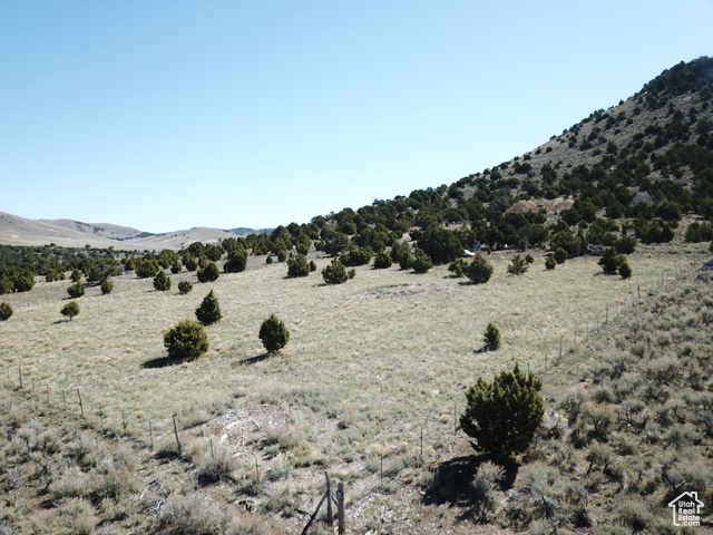 Property view of mountains with a rural view