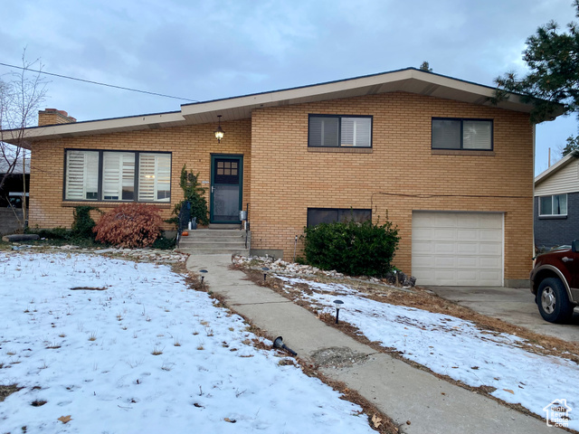 View of front of property with a garage