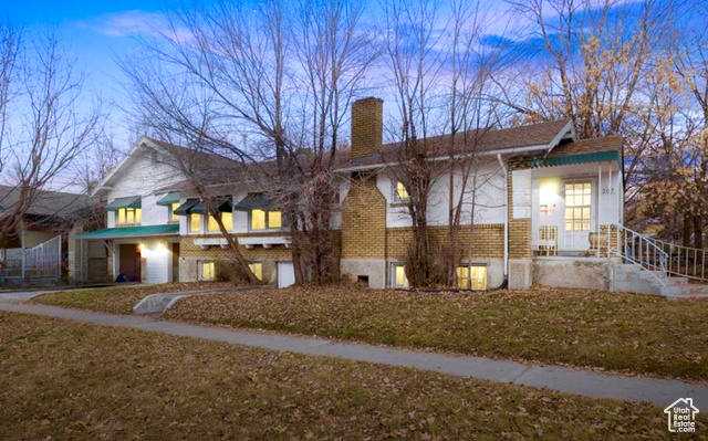 View of front of home featuring a yard