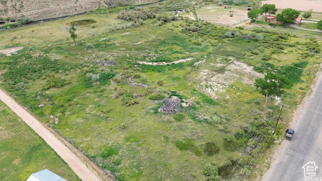 Birds eye view of property featuring a rural view