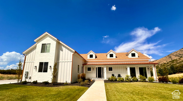 View of front of home with a front yard