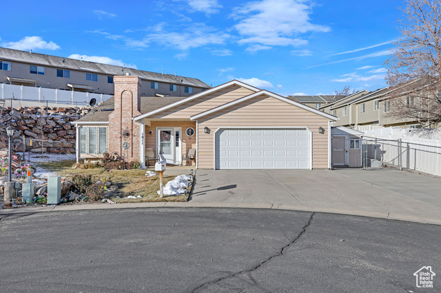 View of front of property with a garage