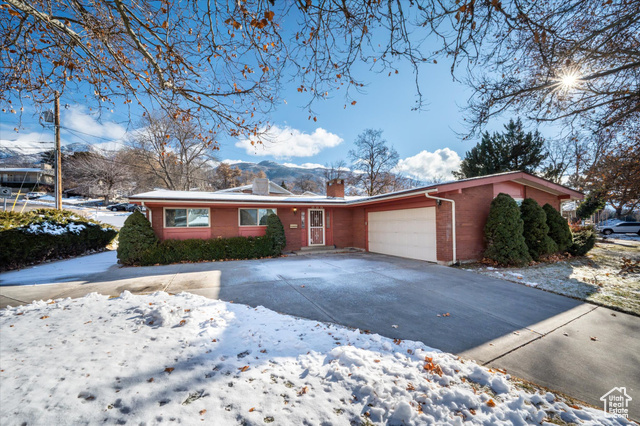 Single story home featuring a garage