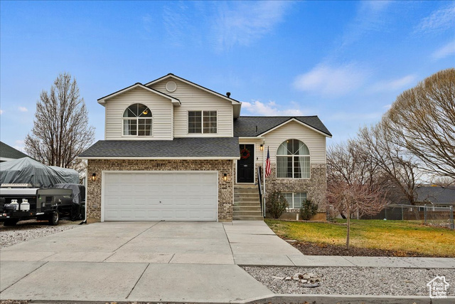 View of front of property featuring a garage