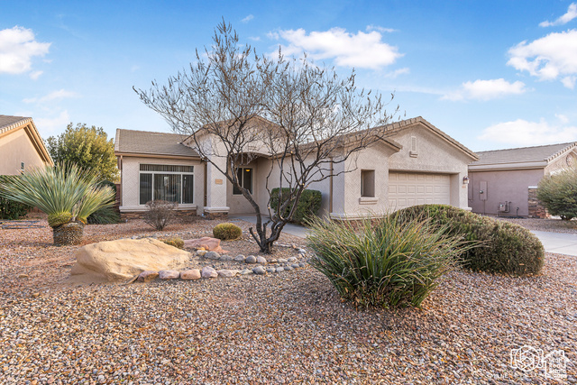 Ranch-style home featuring a garage