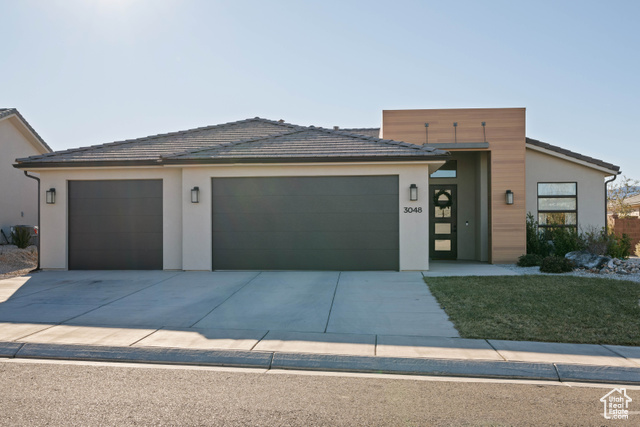 View of front facade featuring a garage