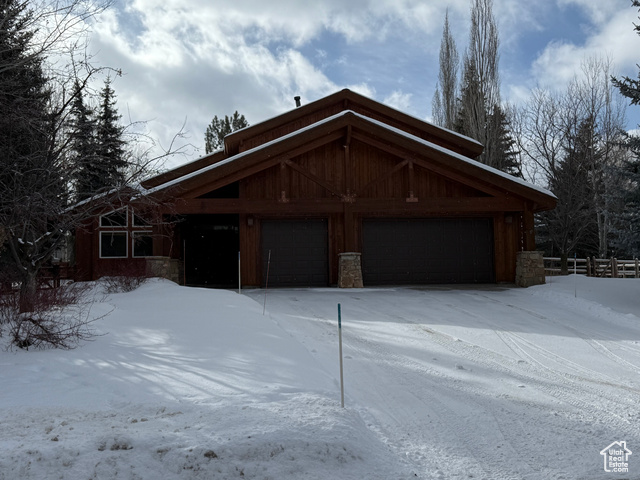 View of front facade featuring a garage