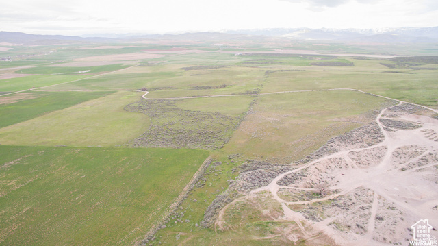 Drone / aerial view with a mountain view and a rural view