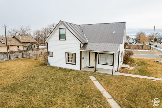 View of front of house with a front yard