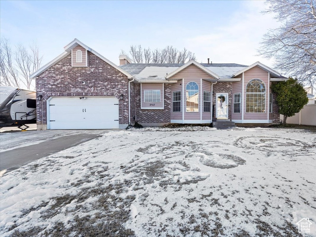 View of front facade featuring a garage