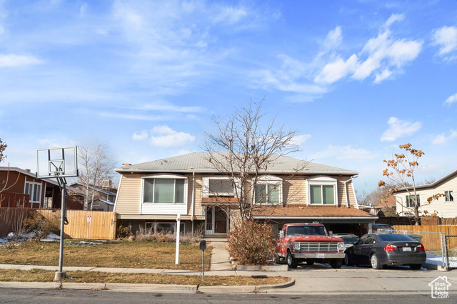 View of front facade featuring a garage