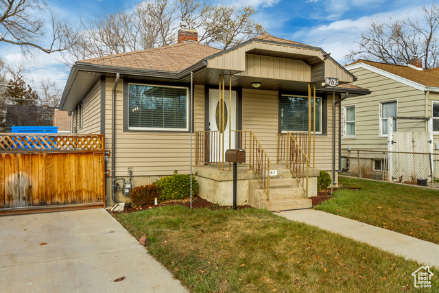 Bungalow-style house with a front yard