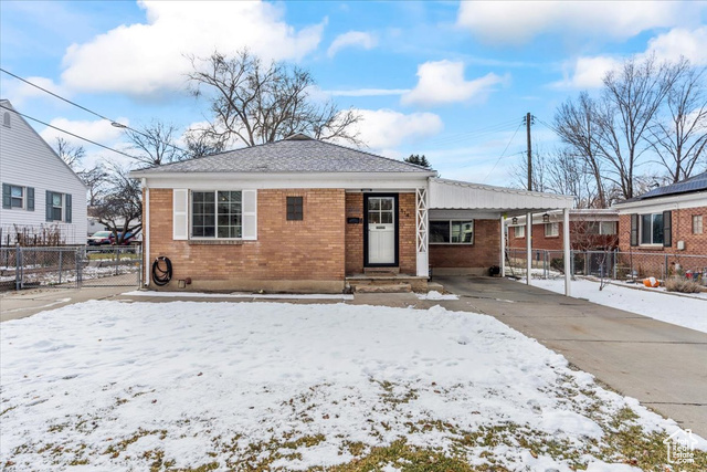 View of front of house featuring a carport