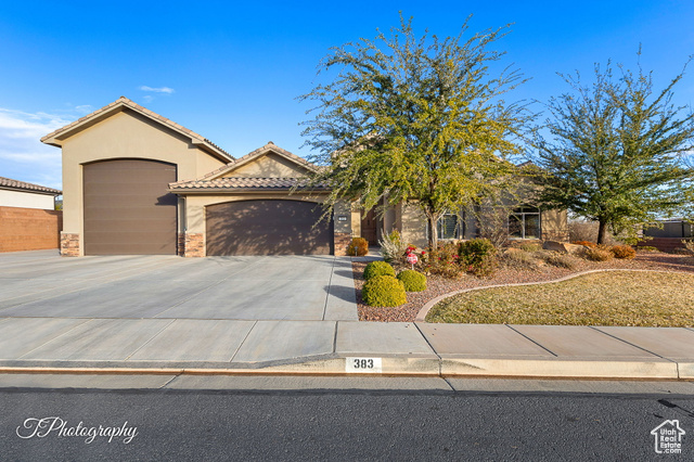 View of front of property featuring a garage