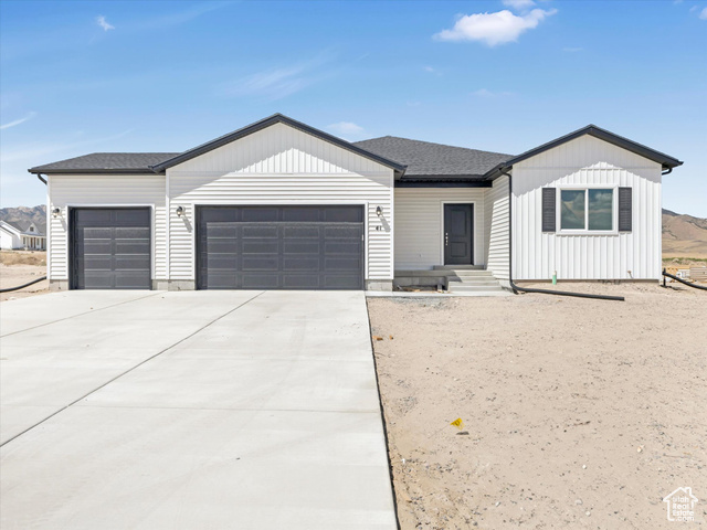 Ranch-style house featuring a garage