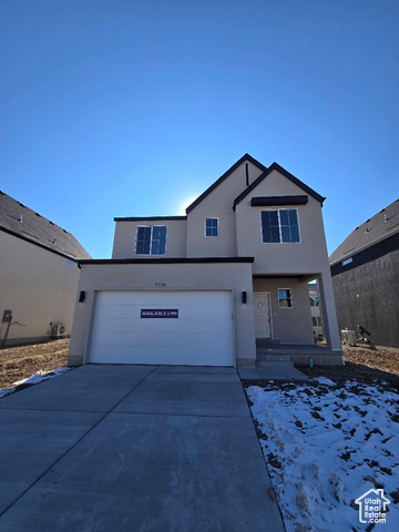 Front of property featuring a garage