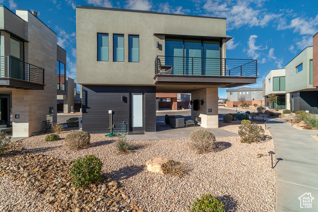 Rear view of property featuring a balcony