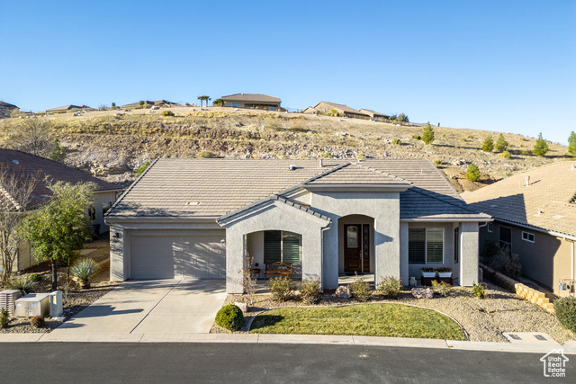 Ranch-style home with a garage