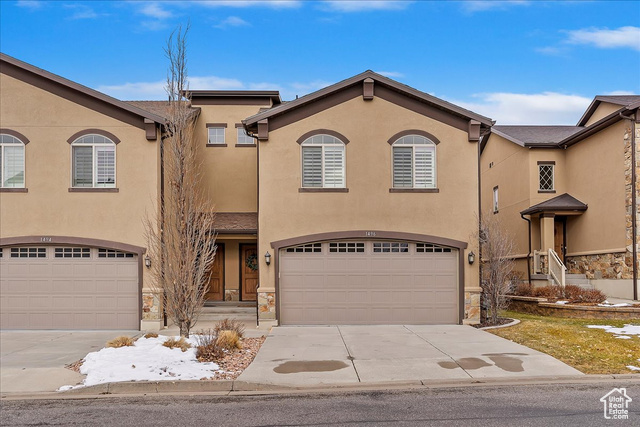 End Unit!  3 bedroom 4 baths townhome. View of front of property with a garage. Basement can also be used as bedroom with built in Murphy Bed