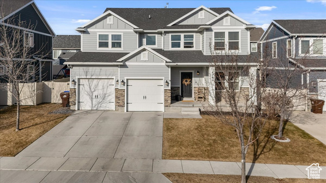 View of front of property featuring a garage