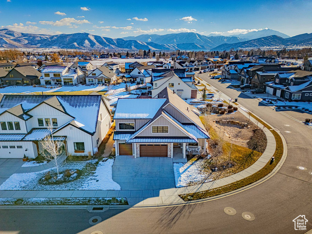 Birds eye view of property with a mountain view