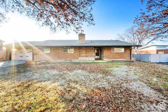 Rear view of property featuring a garage