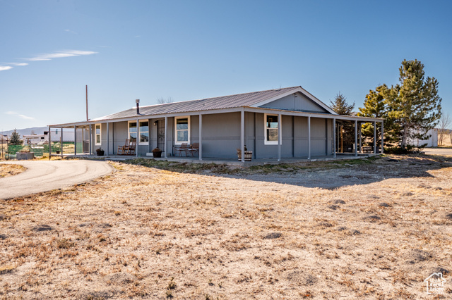 View of front of house with covered porch