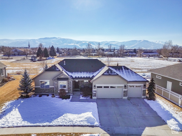 Welcome home to this beautiful 6-bedroom, 3-bath rambler featuring an open floor plan designed for modern living. Backing onto a church's open field, the property offers peaceful privacy and breathtaking views of Mt. Timpanogos. The kitchen is a chef's delight, with a large pantry, abundant storage, and seamless flow into the spacious dining area and living room-perfect for entertaining. The primary suite is a true retreat, complete with dual vanities, a walk-in shower, a luxurious soaker tub, and a generous walk-in closet. The fully finished basement provides three additional bedrooms and a large family room, creating the perfect space for gatherings or relaxation. The oversized 3-car garage ensures there's plenty of room for vehicles, tools, and toys. Step outside to your private patio to enjoy quiet evenings watching the sunset or stroll along the nearby peaceful walking path. This home effortlessly blends style, comfort, and functionality-schedule your private tour today! All information is deemed reliable but is not guaranteed and should be independently verified.