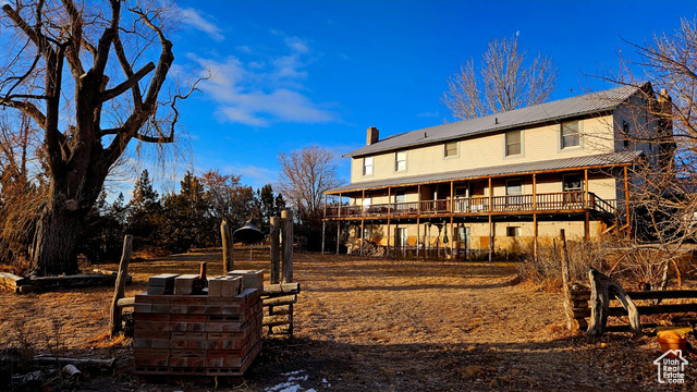 Back of house featuring a deck