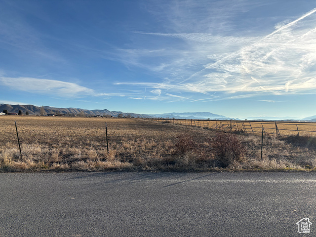 View of yard featuring a mountain view and a rural view