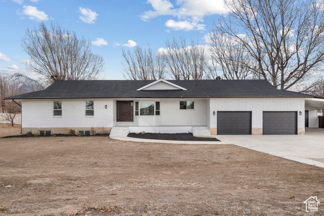 Beautiful remodel rambler with a huge .64 acre yard. The whole home has been fully remodeled. Fully updated kitchen and living room, a big master suite with a walk-in closet, double sinks, a separate tub and shower, a large laundry room, and two more bedrooms. There is a separate entrance with a full basement apartment with a huge family room, a big kitchen, and lots of storage. There's a big 2-car garage, extra parking spaces on the side, RV parking,  two extra storage rooms at the back of the carport and inside the garage. The two-tier deck has been recently refinished along with a gas fireplace for gathering.