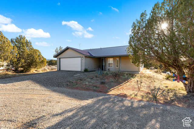 Ranch-style house featuring a garage