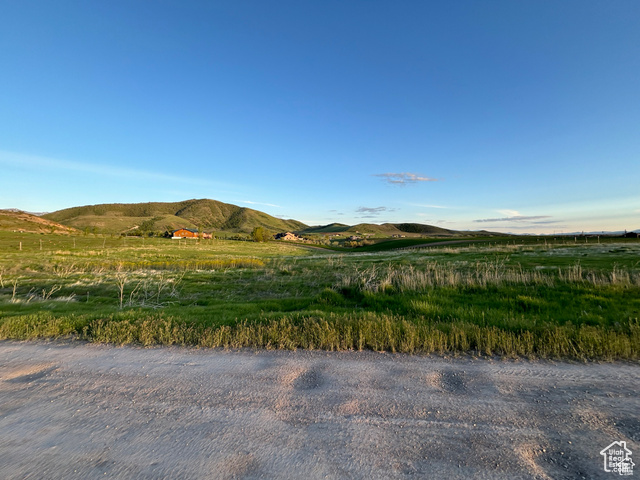 Property view of mountains with a rural view