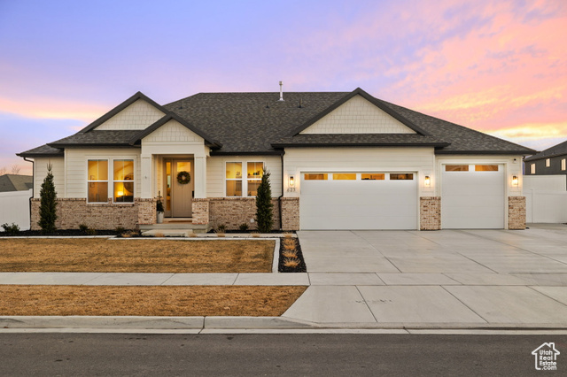 This recently built stunning home redefines modern luxury with impeccable design and attention to detail. The moment you step through the door, you'll be amazed with the tall ceilings and massive windows that fill the space with natural light while sleek blackout blinds throughout the home let you tailor the lighting to your preference. The living room offers a large seating area in front of the beautifully finished stone fireplace. The flawlessly finished kitchen is everyone's dream with its custom ceiling-high cabinets, high-end quartz countertop, luxury appliances, and hidden butler pantry. The primary bedroom is gorgeous, complementing the stunning bathroom and a walk-in custom closet that is so large it will leave you speechless. The recently finished walk-out basement is prime for guests/extended family featuring a full kitchen, 3 bedrooms, 2 full bathrooms, and a gym. Even the massive 3-car garage is worth bragging about with its epoxy floors, painted walls and ceilings, and ample space for storage. Last but not least, the backyard is fully landscaped with enclosed fencing, planter boxes, a play set, and a paver patio designed for a fire pit, hot tub and shed, creating the ultimate outdoor oasis. The seller recently invested over $250,000 in this home and yard to make it the perfect setup for you, so reach out for your private tour before it's too late!