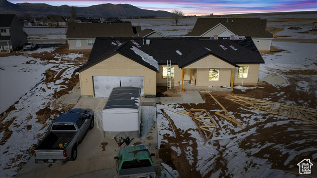 View of front of home featuring a mountain view