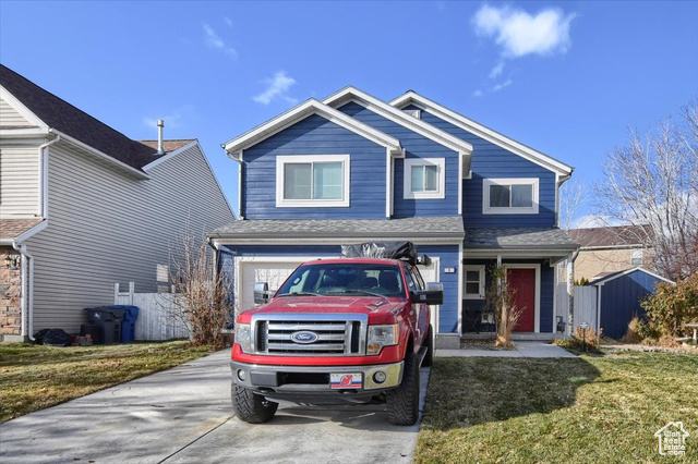 This stunning home feels brand new and boasts a beautifully landscaped yard, complete with a fence, sprinkler system, and lush greenery. Located in the desirable Saratoga Springs area, just 8 minutes from I-15, this home offers the perfect balance of convenience and serenity. Enjoy the peaceful setting next to Utah Lake, surrounded by a bird sanctuary and natural wildlife habitat, with the Jordan River bike path just a short walk away. The home has been meticulously updated with Hardi plank siding, a new roof, and a smart Bhyve irrigation system. Inside, you'll find two-year-old luxury vinyl plank flooring, stylish new fixtures, and sleek stainless steel appliances. The kitchen features stunning quartz countertops. Enjoy modern comforts such as a jetted tub in master bath with a tile surround, and a Level 2 car charger outlet. Solar panels are fully paid off, and the home comes with an FHA assumable loan at an attractive 5.65%. This home is a must-see-schedule a showing today! Square footage figures are provided as a courtesy estimate only and were obtained from tax data. Buyer is advised to obtain an independent measurement.