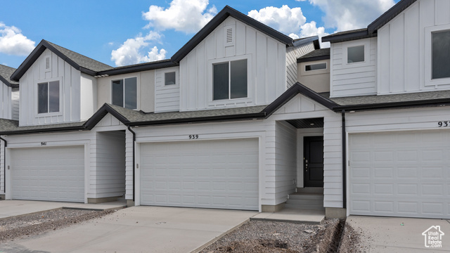 View of front of property featuring a garage