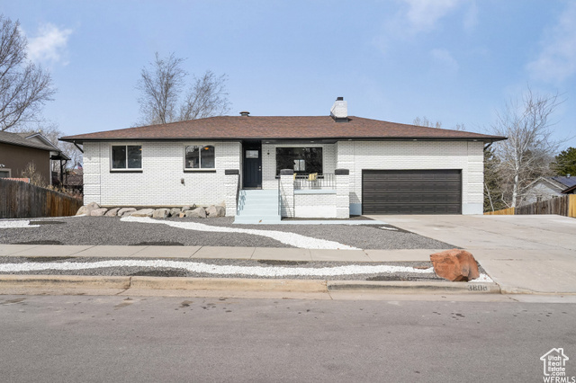 Ranch-style house featuring a garage