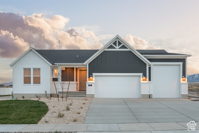 View of front of house with a garage and covered porch