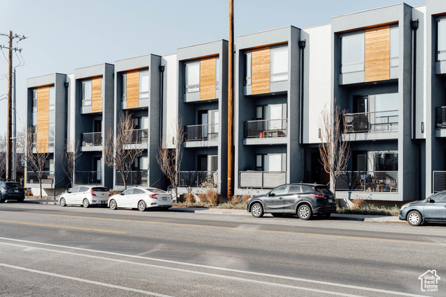 Built in 2019 by the fellas over at Urban Alfandre, these Row 17 Condominiums seek to maximize space and functionality while keeping an eye toward modern design aesthetics. With large picture windows, quartz countertops and intentionally-designed layouts, these units are light and airy with a heavy dollop of coolness.    This South facing two bedroom, two bathroom garden level residence boasts 9' ceilings, a private deck and a covered parking space. The central living space makes for easy entertaining. We love how the moody exterior of dark stucco and wrought iron gets a touch of warmth from the cedar plank accents.    Positioned smartly within walking distance of several coffee shops, bakeries and bars as well as easy access to TRAX and the highway, you're gonna love living in this commuter and pet-friendly community.