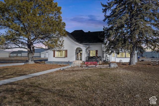 Bungalow-style home with a yard