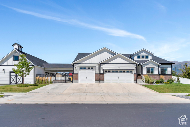 This freshly painted two-story home was built in 2016, is located in the vibrant community of Vineyard, Utah. Spanning over 6,000 square feet, it offers seven spacious bedrooms and five full bathrooms, providing comfort and space for a large family or guests. The four-car garage ensures ample room for vehicles and additional storage or a home gym. The backyard is designed for entertainment and relaxation, featuring a large fire pit, an inviting outdoor entertaining space, and a basketball court for sports enthusiasts. A trampoline and swing set make it a haven for all, while the vegetable garden boxes allow you to grow your own fresh produce this upcoming Summer. With RV parking available, this home is perfect for those with a love for adventure or need the space for a home business. Inside, the home boasts abundant storage and a large unfinished room, offering endless possibilities. Whether you dream of creating a serene yoga studio or a dynamic sports training room, this space is ready to be tailored to your needs. Located in a prime area, this home is surrounded by shopping and dining options, ensuring convenience at every turn. A local park is less than a block away offering a great place for outdoor activities, while jogging trails along Utah Lake provide easy access to water sports and stunning views plus the elementary school is kitty corner across the street. This property combines luxury living with the benefits of a thriving community, offering the best of both worlds.