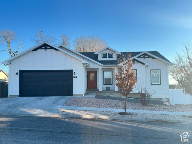 View of front facade featuring a garage