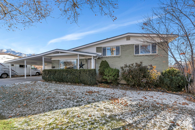 GORGEOUS RENOVATED 4 bed HOME in Murray! This home is an absolute GEM with 50K in recent renovations which include an incredible open concept, NEW AC, new flooring, beautiful fireplace, gourmet kitchen with new cabinets, countertops, appliances, canned lights throughout, upgraded honeycomb shades, and TONS of storage! Home has a large sunroom off of the kitchen for additional living space. Outside has parking for 8+ cars (and RV Parking) and a full sprinkler system!  This home won't last long so schedule your showing today!