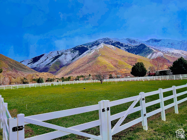 Property view of mountains with a rural view