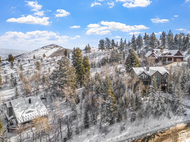 Snowy aerial view with a mountain view