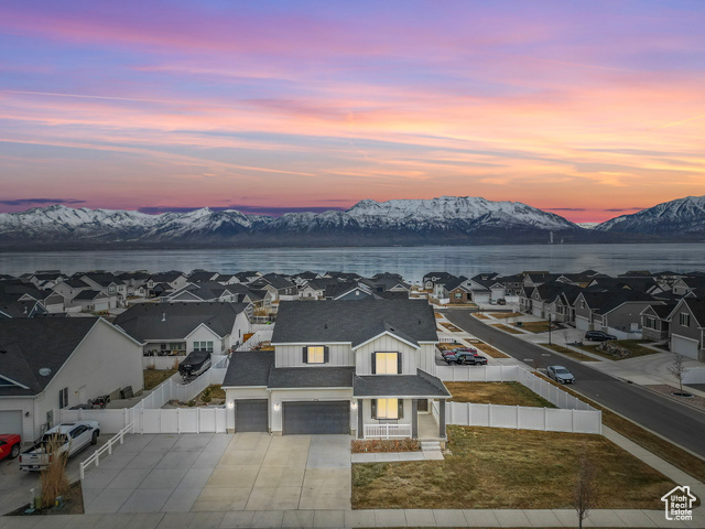 Aerial view at dusk with a water and mountain view